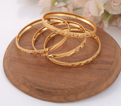 4-Piece Gold-Plated Geometric Textured Bangle Set Traditional Greek Key Inspired Bracelets