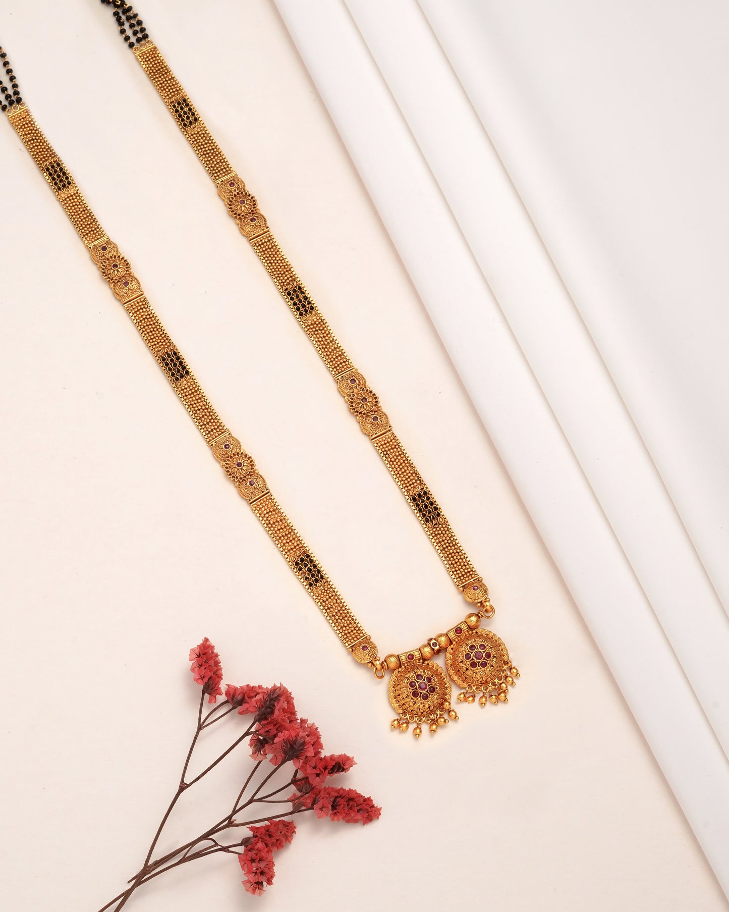 Antique Gold Jhumka Earrings with Emerald Green Accents - Traditional Indian Jewelry