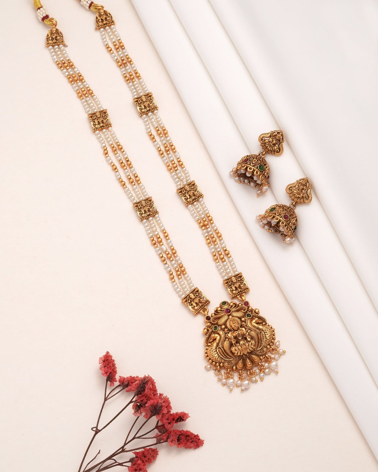 Antique Matte Gold Goddess Lakshmi Long Necklace Set - Triple Strand Pearl Haram with Matching Jhumka Earrings & Kemp Stone Accents