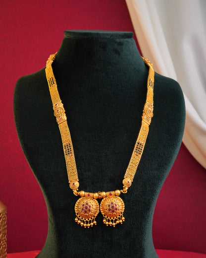 Antique Gold Jhumka Earrings with Emerald Green Accents - Traditional Indian Jewelry