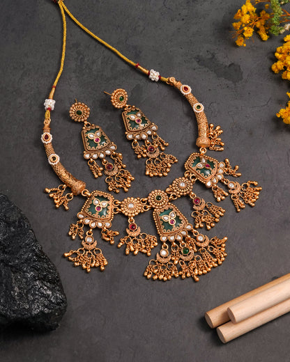 Traditional Kundan Necklace Set with Green Stones & Jhumka Earrings