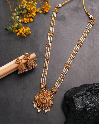 Antique Matte Gold Goddess Lakshmi Long Necklace Set - Triple Strand Pearl Haram with Matching Jhumka Earrings & Kemp Stone Accents