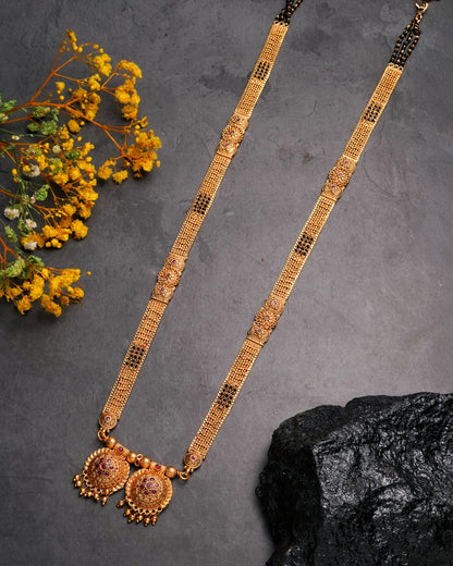 Antique Gold Jhumka Earrings with Emerald Green Accents - Traditional Indian Jewelry