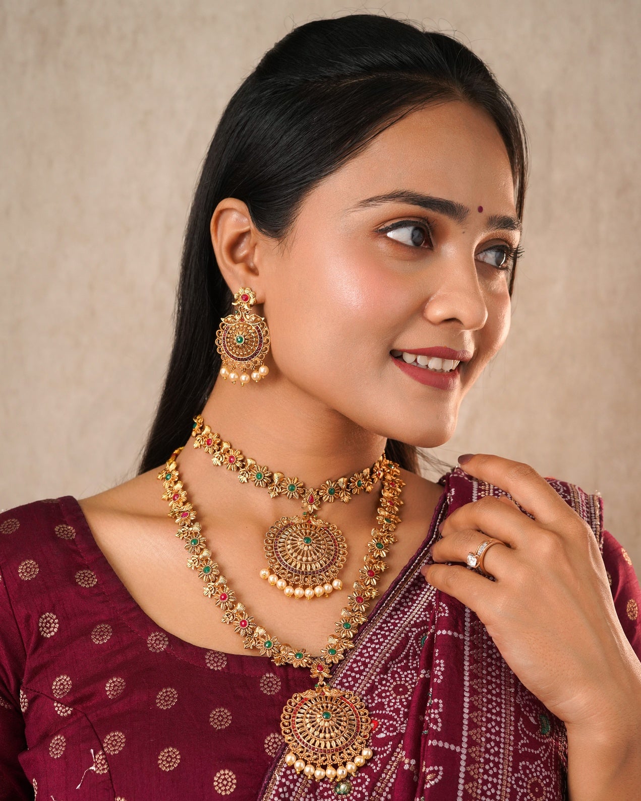 Antique Gold-Plated Dual Necklace Set with Circular Floral Pendants and Matching Jhumkas