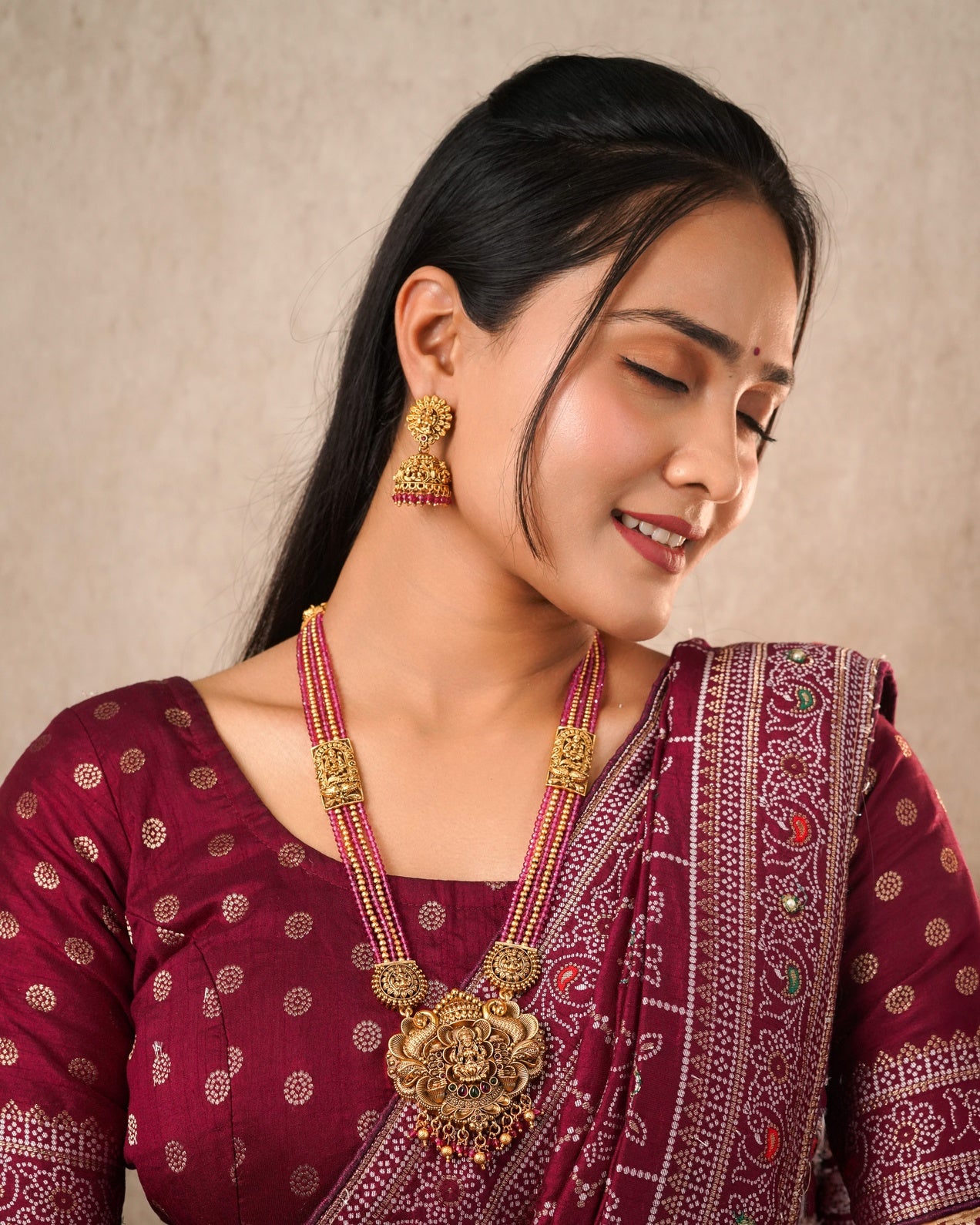 Traditional Antique Gold-Plated Lakshmi Pendant Haram - Ruby Pink Multi-Strand Bead Long Necklace with Matching Jhumka Earrings