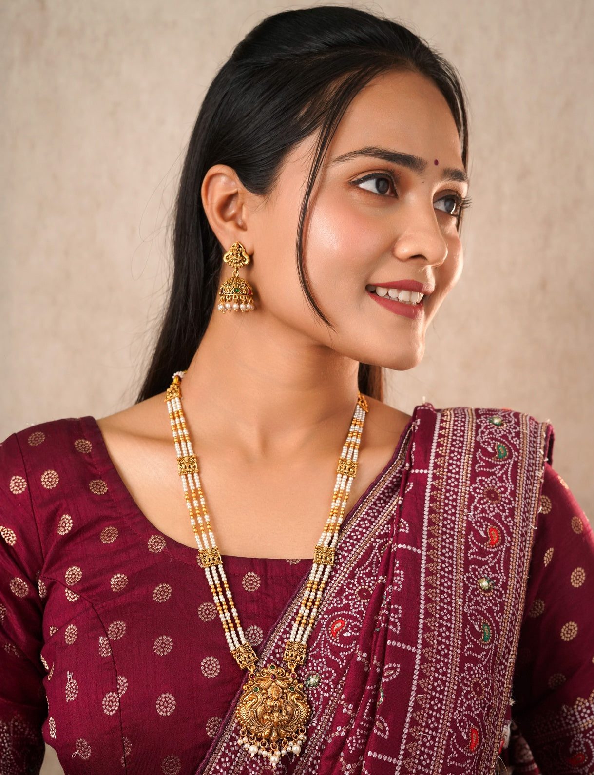 Antique Matte Gold Goddess Lakshmi Long Necklace Set - Triple Strand Pearl Haram with Matching Jhumka Earrings & Kemp Stone Accents