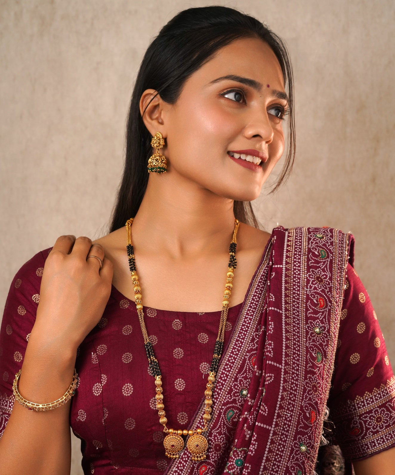 Traditional Gold-Plated Long Mangalsutra with Black Beads and Floral Pendant