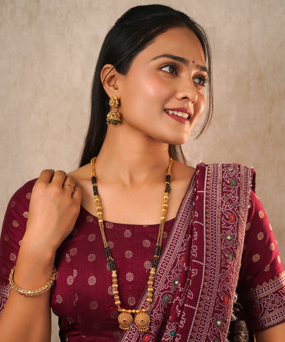 Traditional Gold-Plated Long Mangalsutra with Black Beads and Floral Pendant