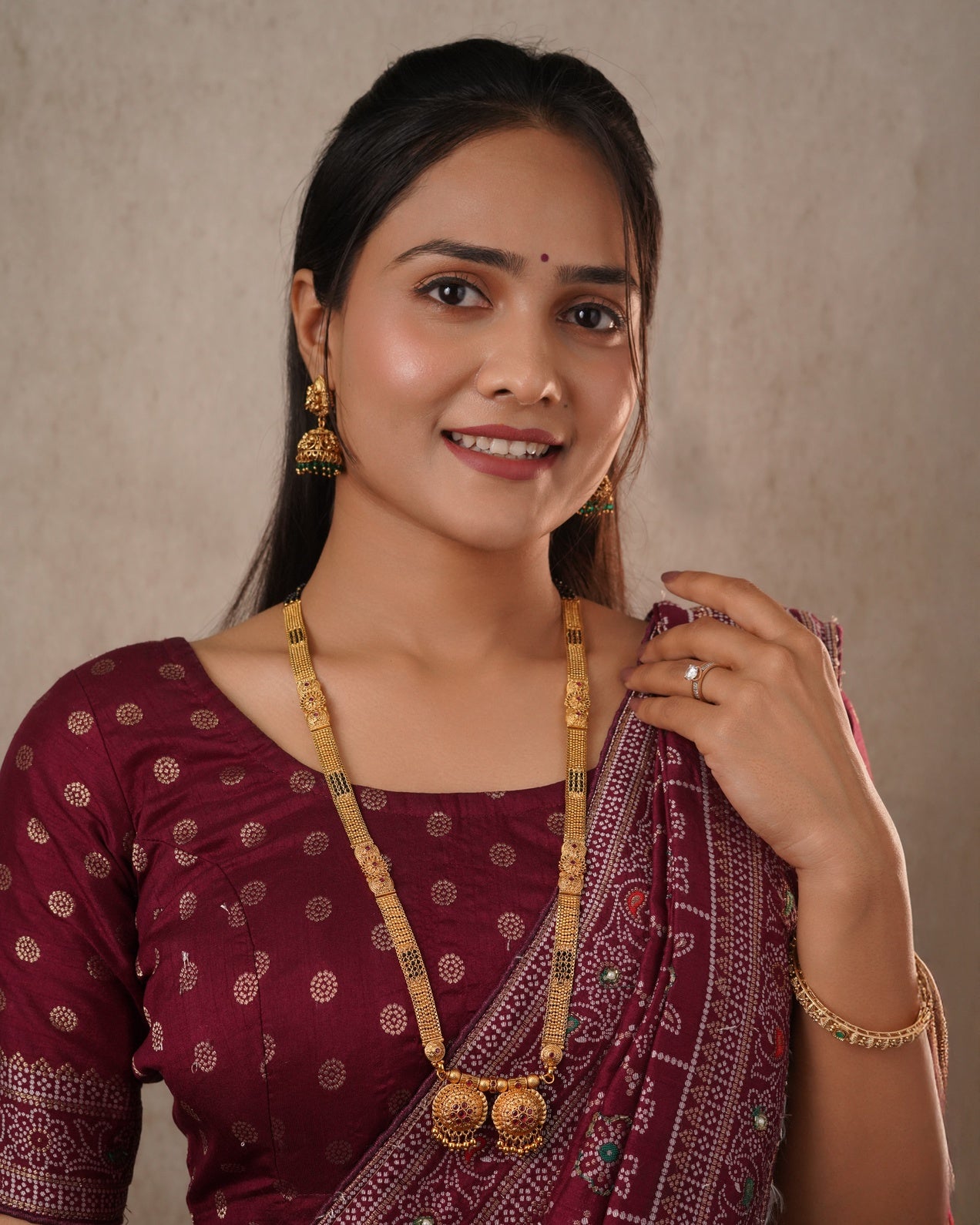 Antique Gold Jhumka Earrings with Emerald Green Accents - Traditional Indian Jewelry