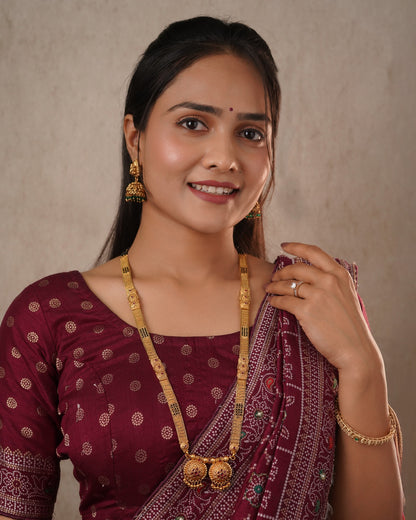 Antique Gold Jhumka Earrings with Emerald Green Accents - Traditional Indian Jewelry